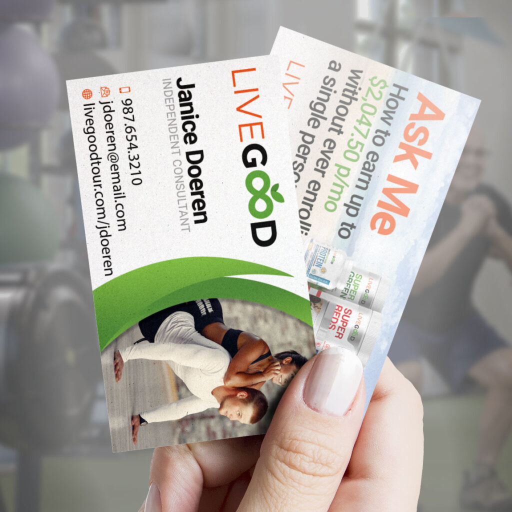Hand holding both sides of the LiveGood business card.