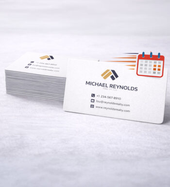 A stack of rounded corner business cards with a fast moving calendar symbolizing rush service for next day printing.
