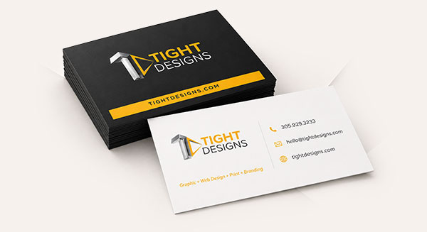 Black and white business card stacked next to eachother.
